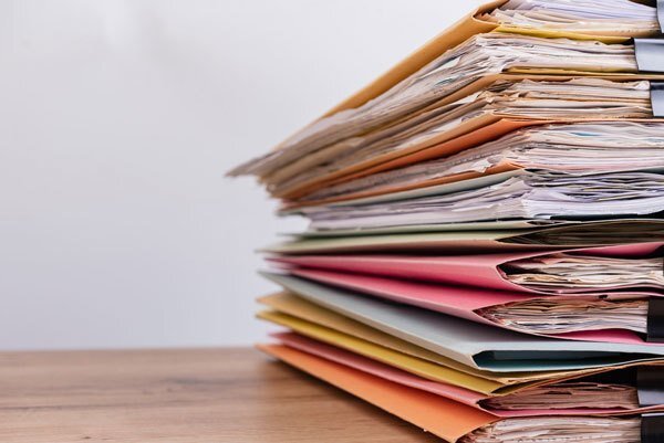 Stack of files filled with papers