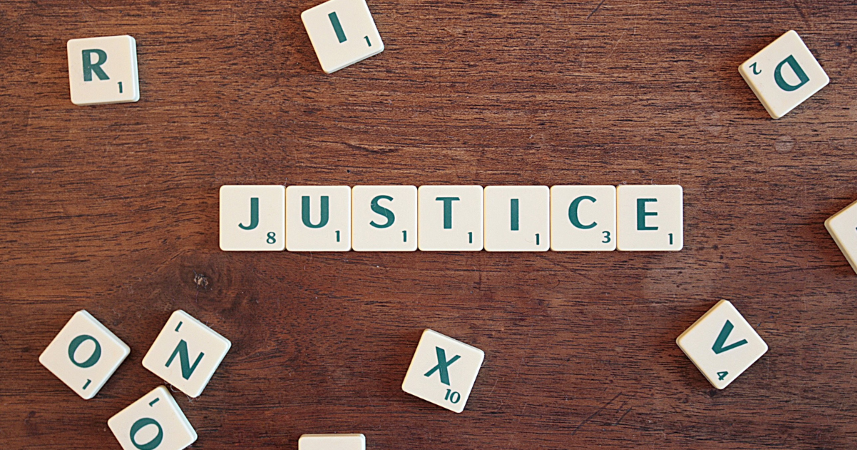 Scrabble letters spelling out the word justice